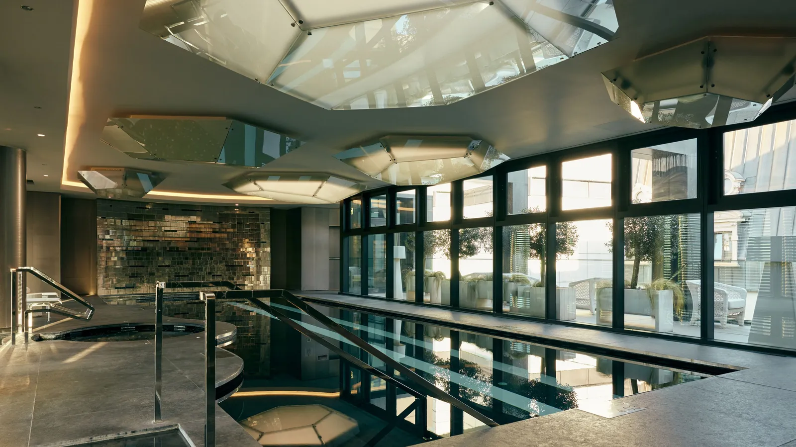 The hotel’s covered pool, with its lit lanes, glass walls and octagonal skylights