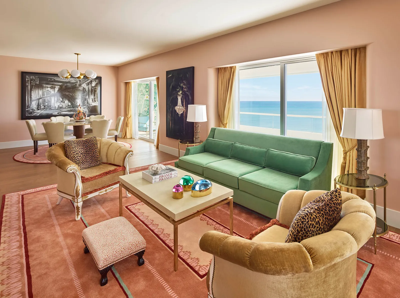 The Imperial Suite’s living room: the green sofa, pale armchairs, a pink carpet and gold curtains.