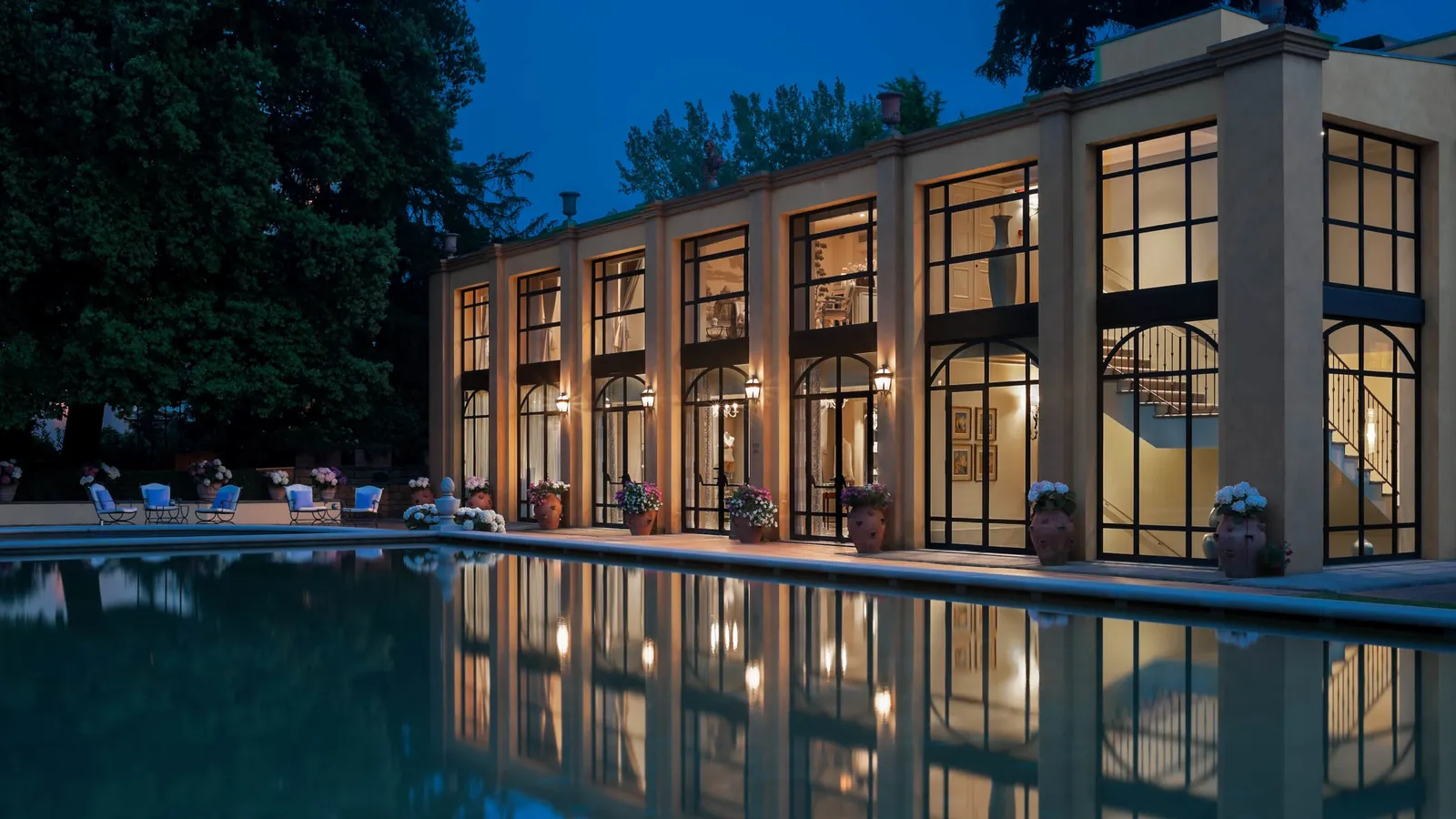 The illuminated spa beside the water at dusk