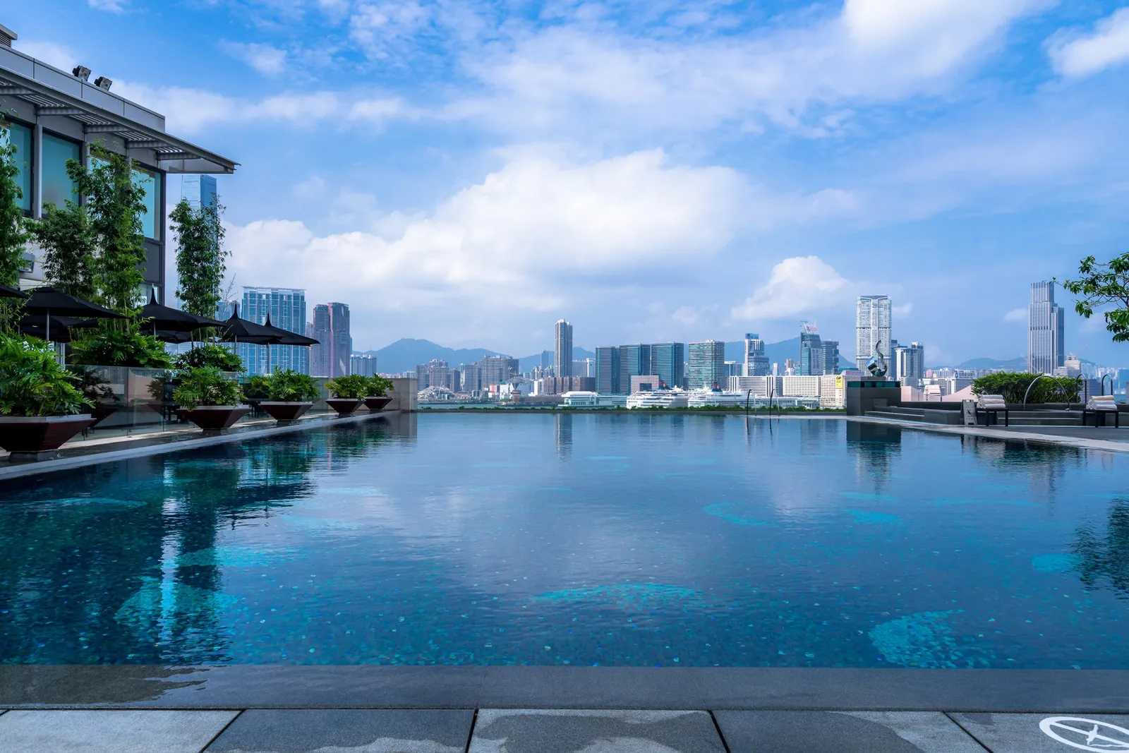Four Seasons Hotel Hong Kong pool terrace overlooking Victoria Harbour