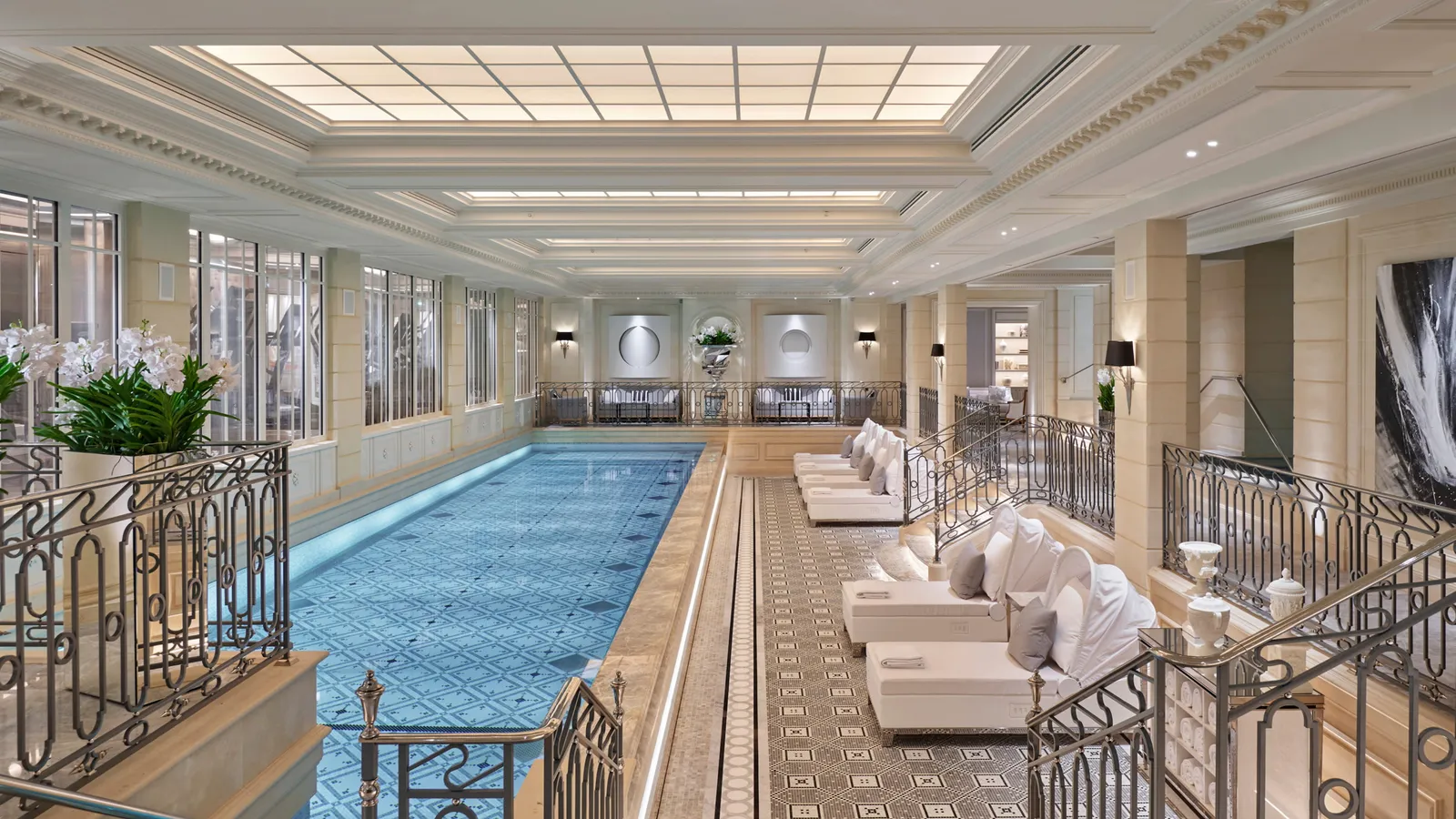 The indoor pool with loungers and columns