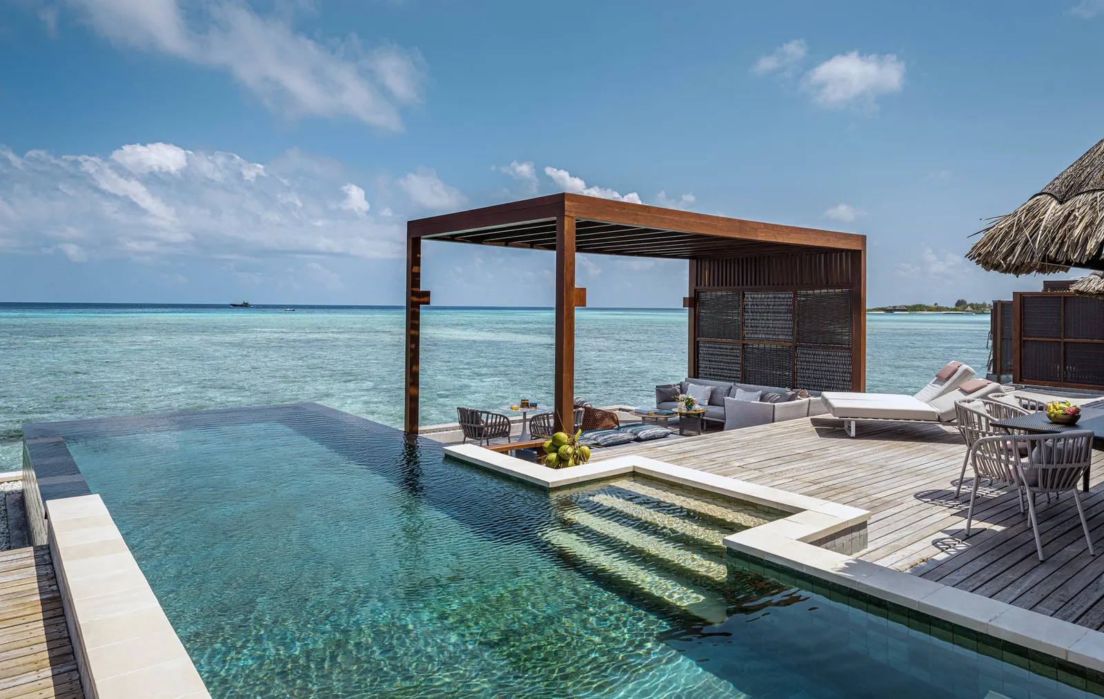 The Family Two-Bedroom Water Suite’s infinity pool and the gazebo on its deck