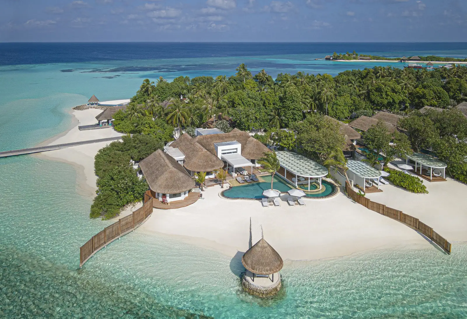 The Kuda Estate from the air on its own beach, with its pool and overwater pavilion