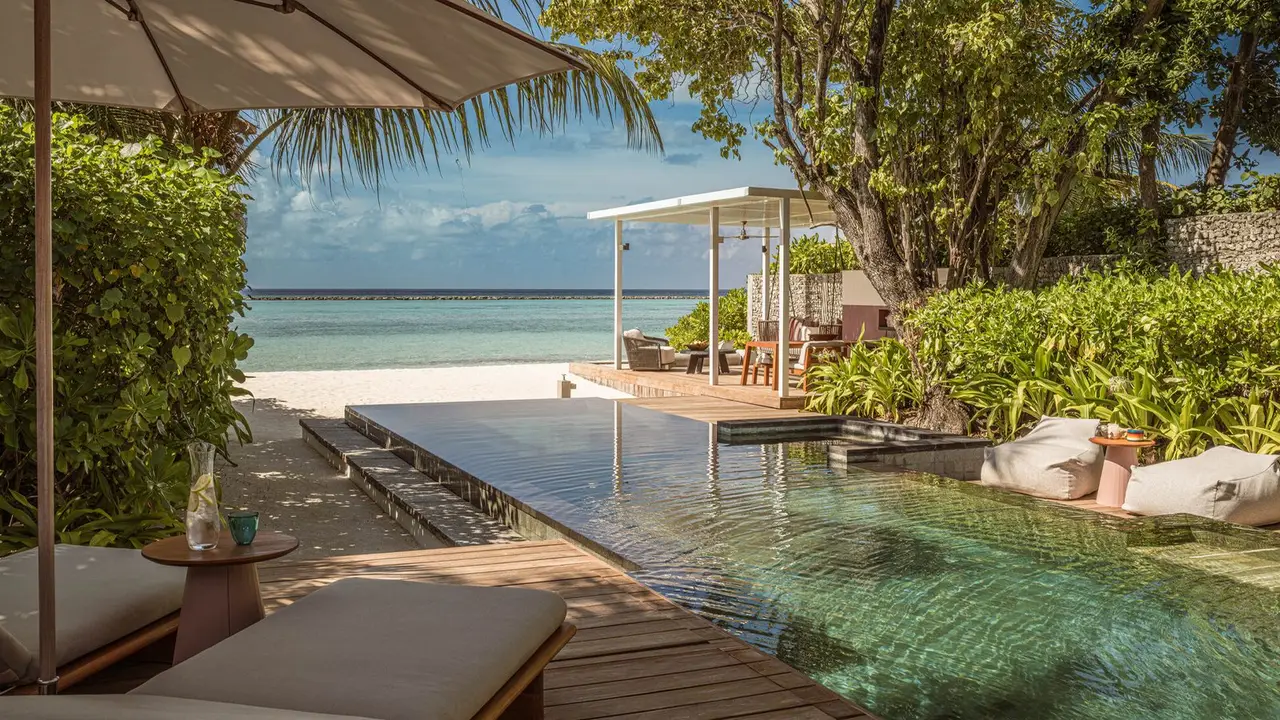 A Beach Villa with Pool: its private pool and deck among the greenery