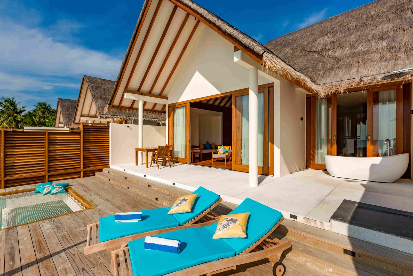 An Ocean Villa Infinity deck, its loungers and the open-air bathtub
