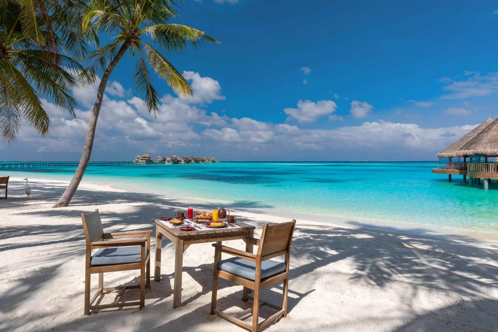 A Kashiveli breakfast table on the sand, facing the lagoon