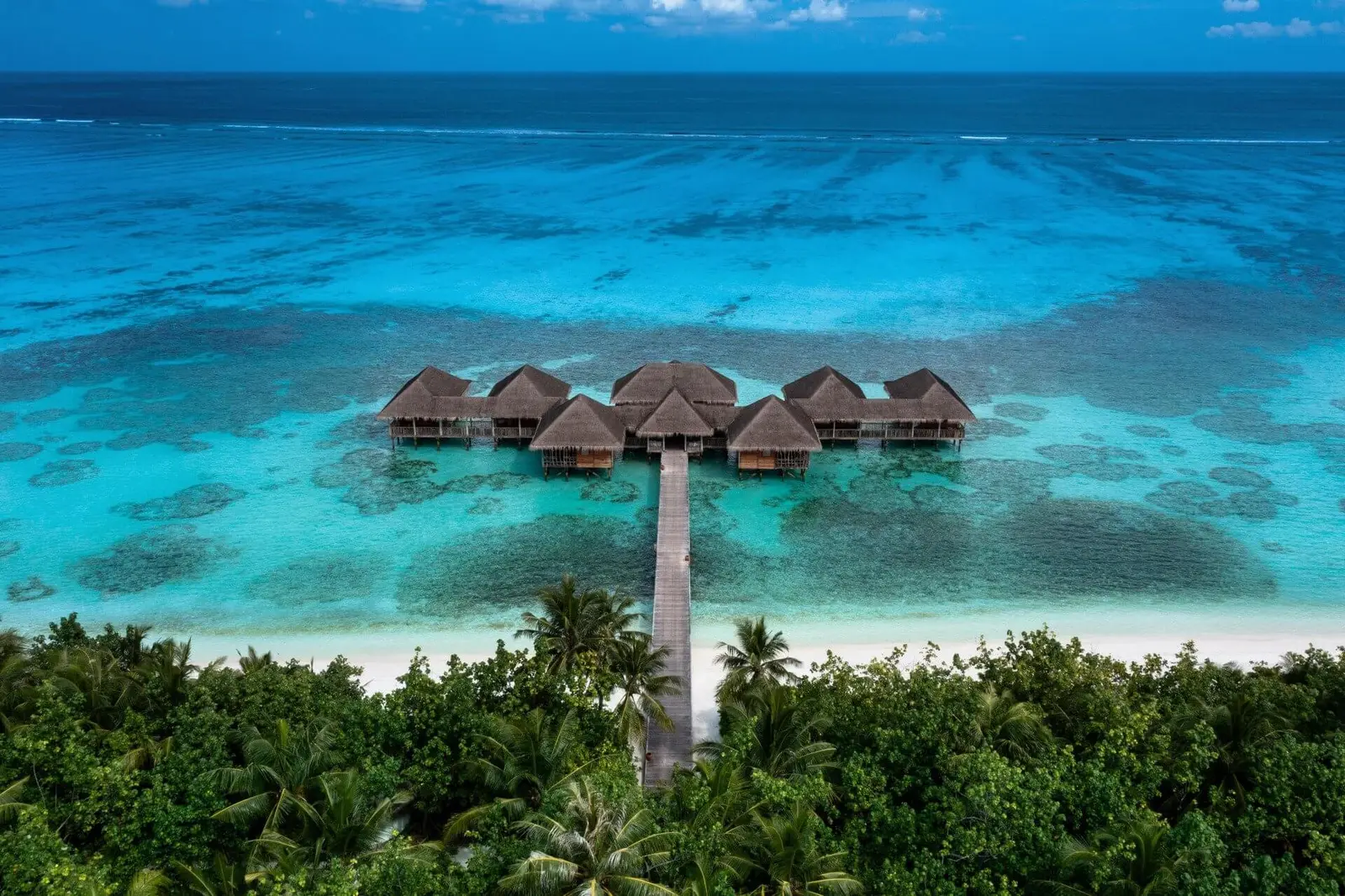 Meera Spa from the air, its pavilions over the water at the end of the jetty