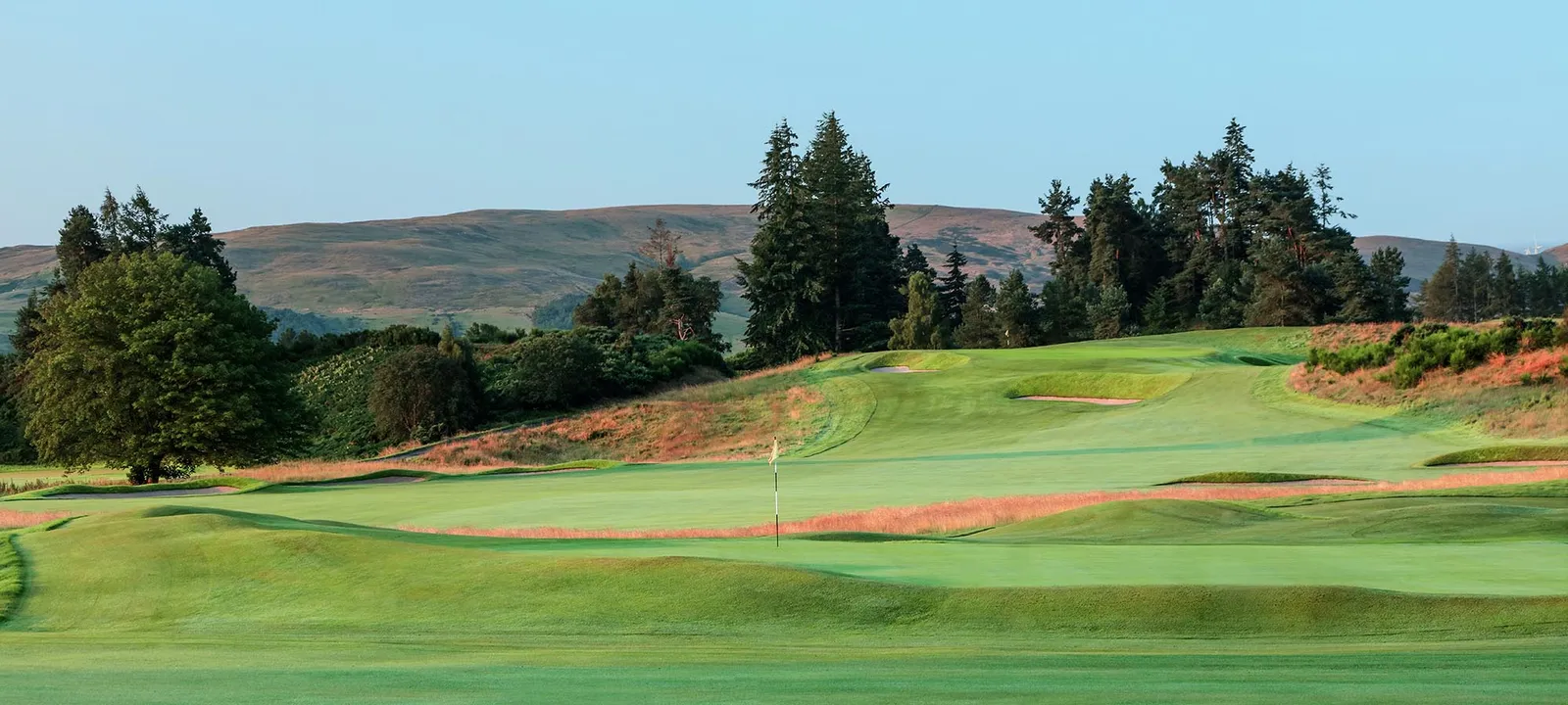 A green on the King’s Course with the hills beyond