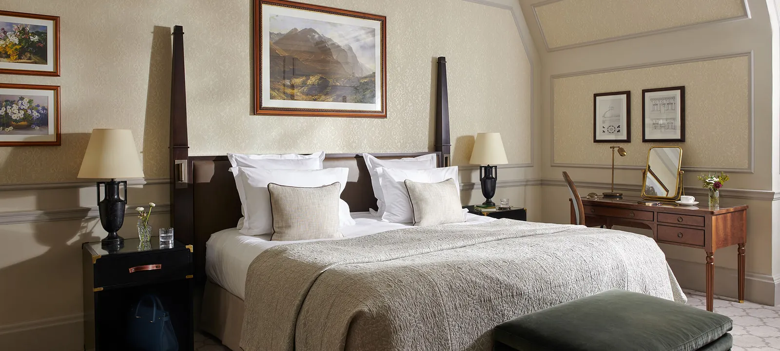 A Country Room with a king bed and a mountain painting