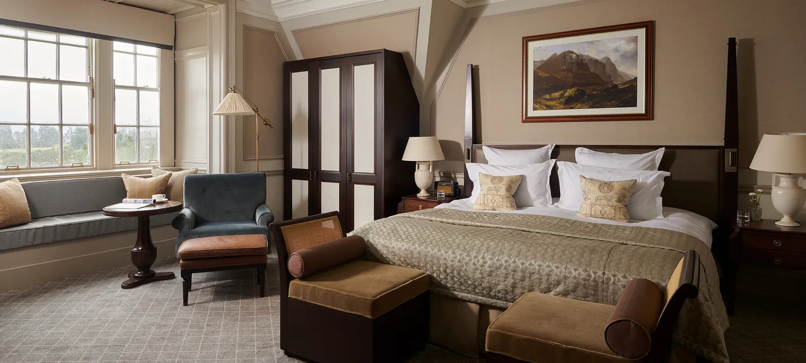 A One Bedroom Whisky Suite’s bedroom, a four-poster and a window seat