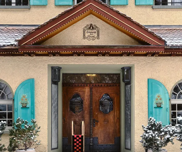 The entrance with green shutters