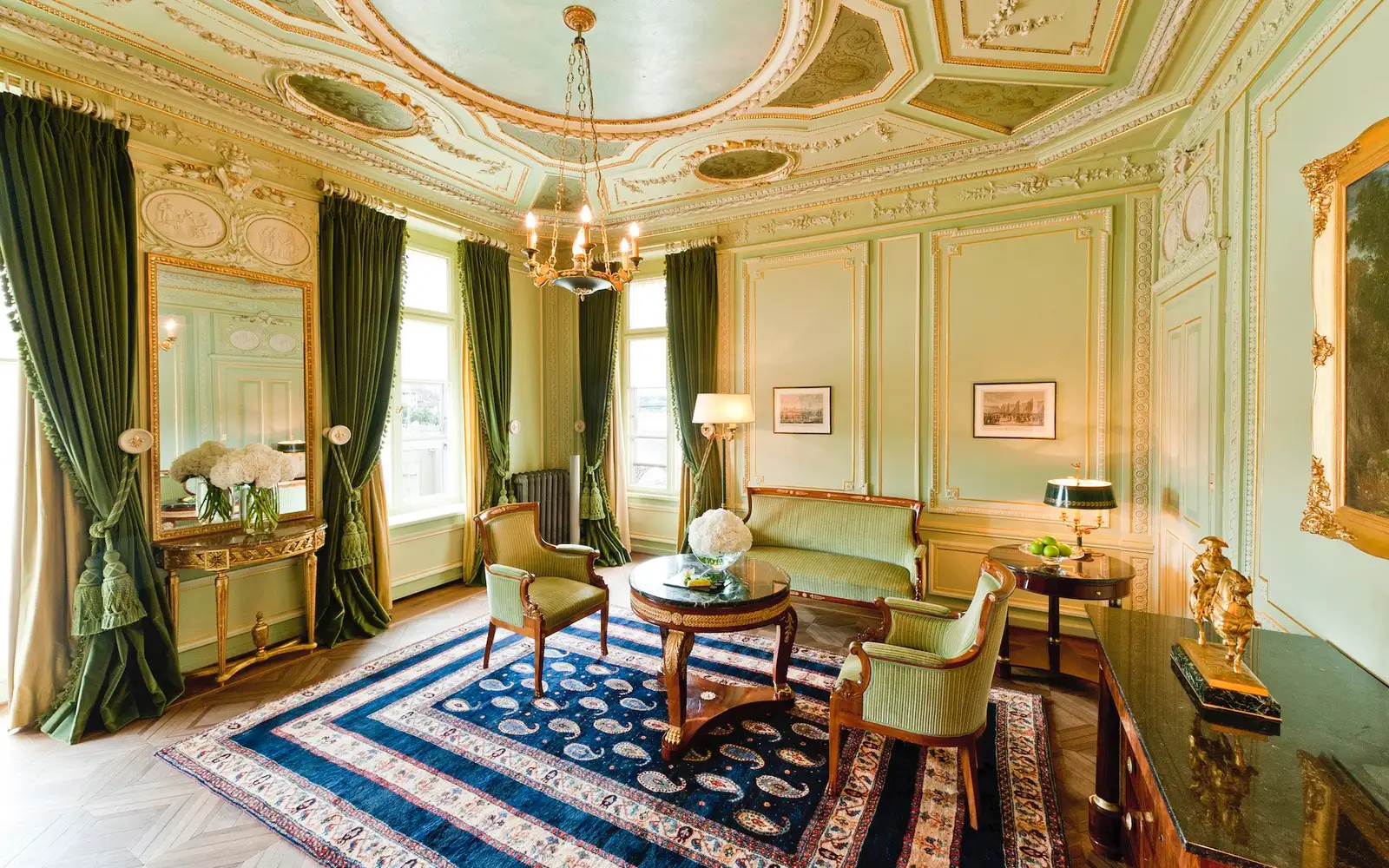 The Napoleon Suite salon, with green walls and gilding