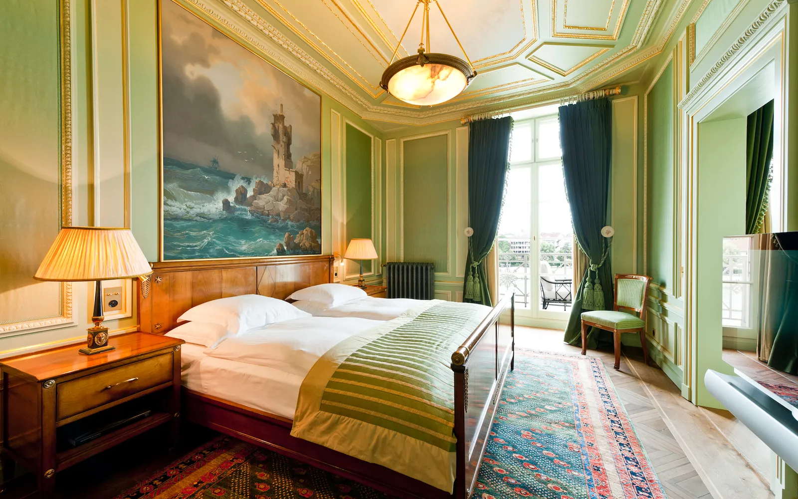 The Napoleon Suite bedroom, with its lighthouse painting