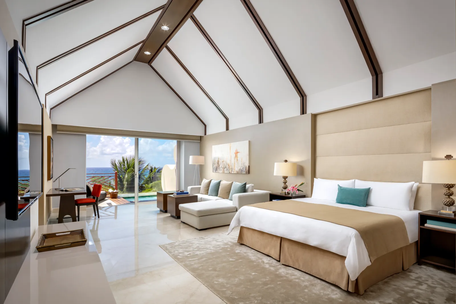 The Governor Suite’s bed and living area, opening towards the sea