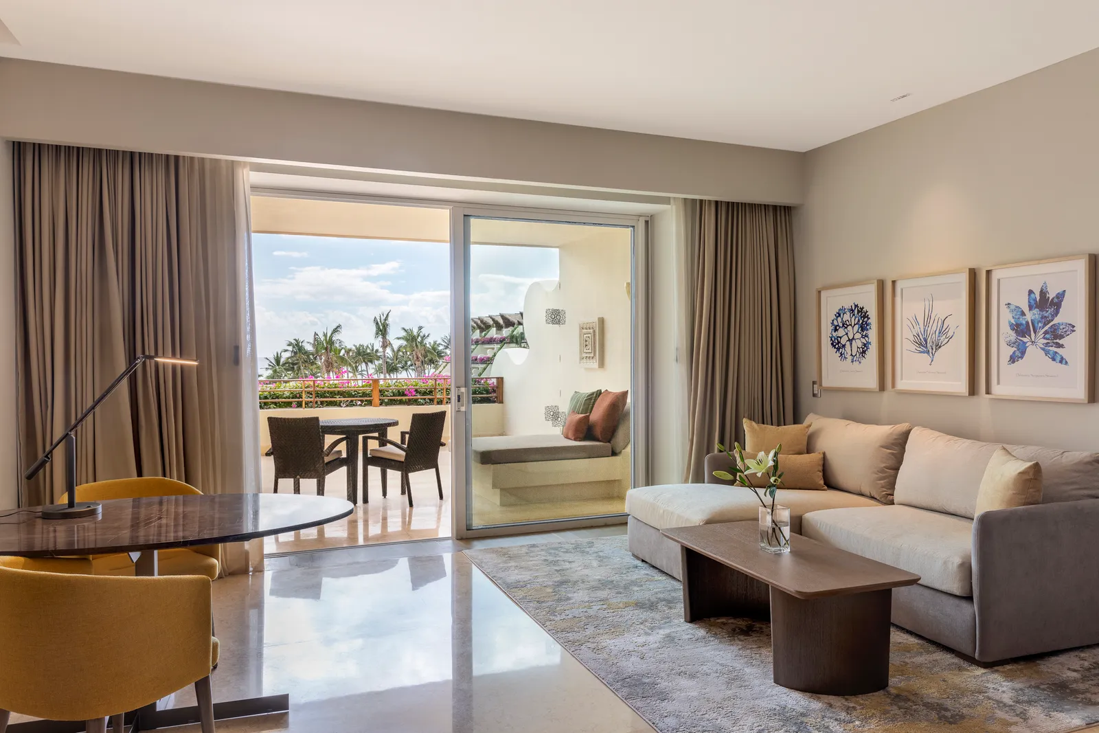 Sofa, coffee table and terrace in the Ambassador Ocean View Suite