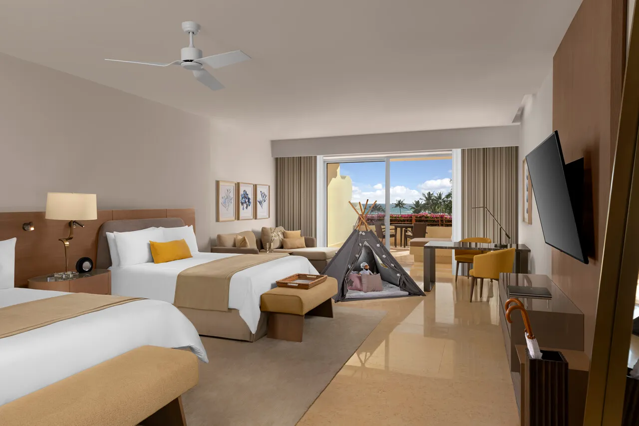 Bedroom with 2 beds and a terrace in the Ambassador Family Suite