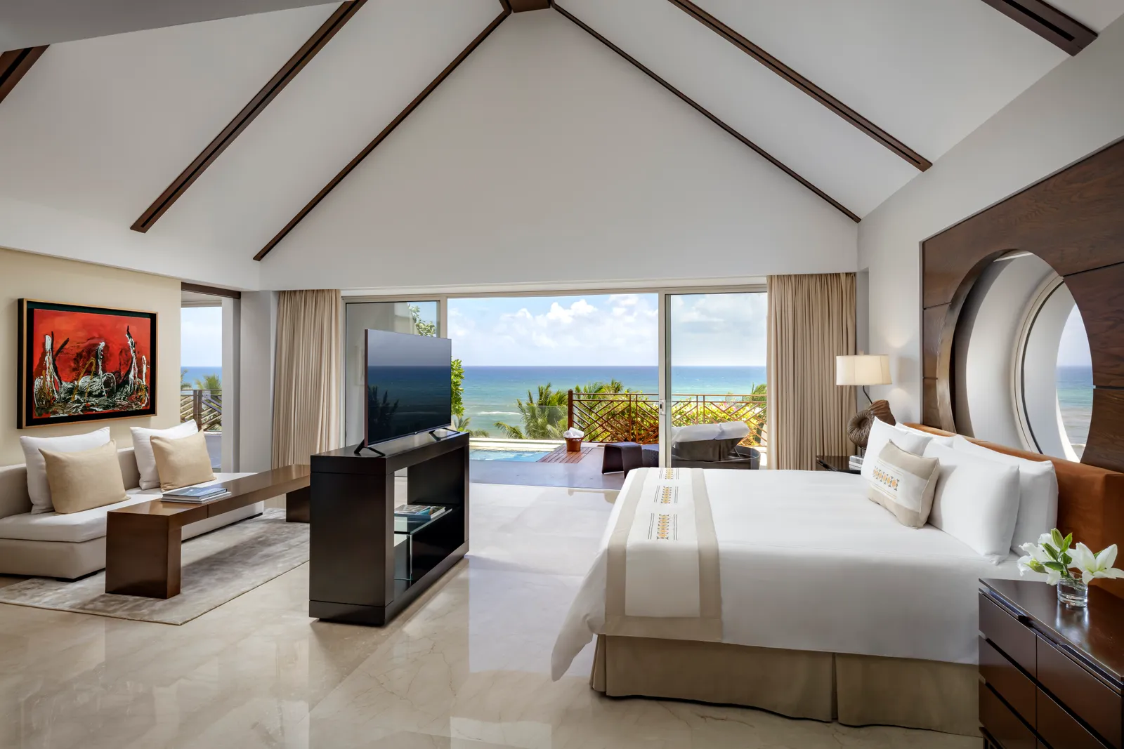 Bed and sitting area in the Grand Class Presidential Suite