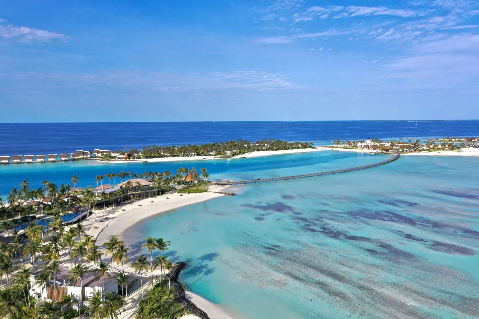 The hotel beach and a long footbridge across the lagoon towards the other CROSSROADS islands