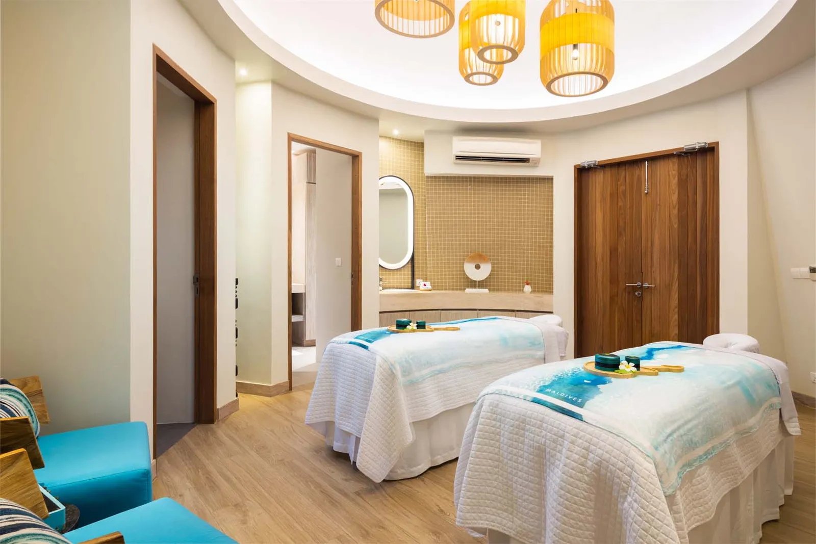 The Rock Spa’s double treatment room, 2 massage beds under wicker lamps