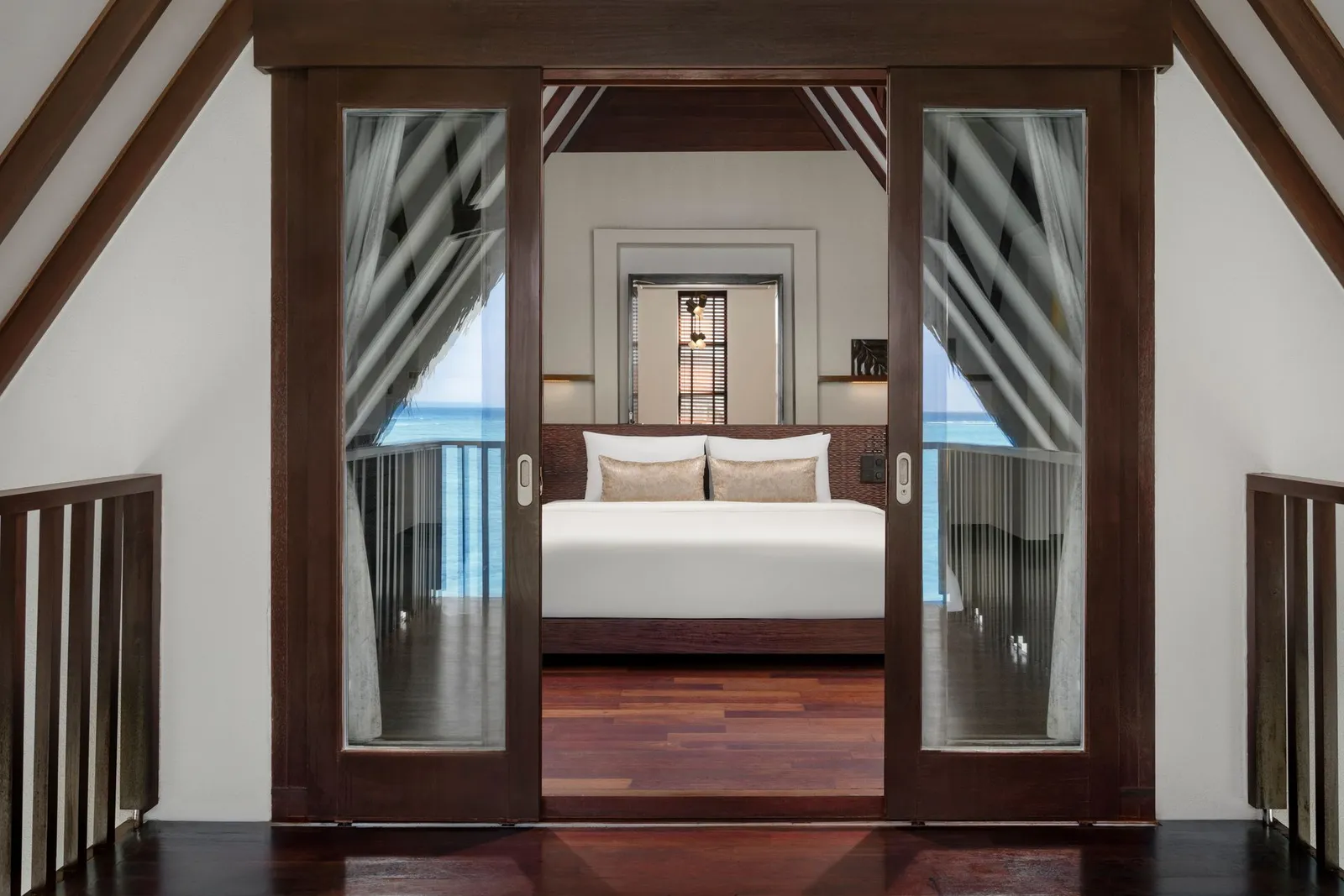 Ocean Residence bedroom with doors to a sea-facing balcony