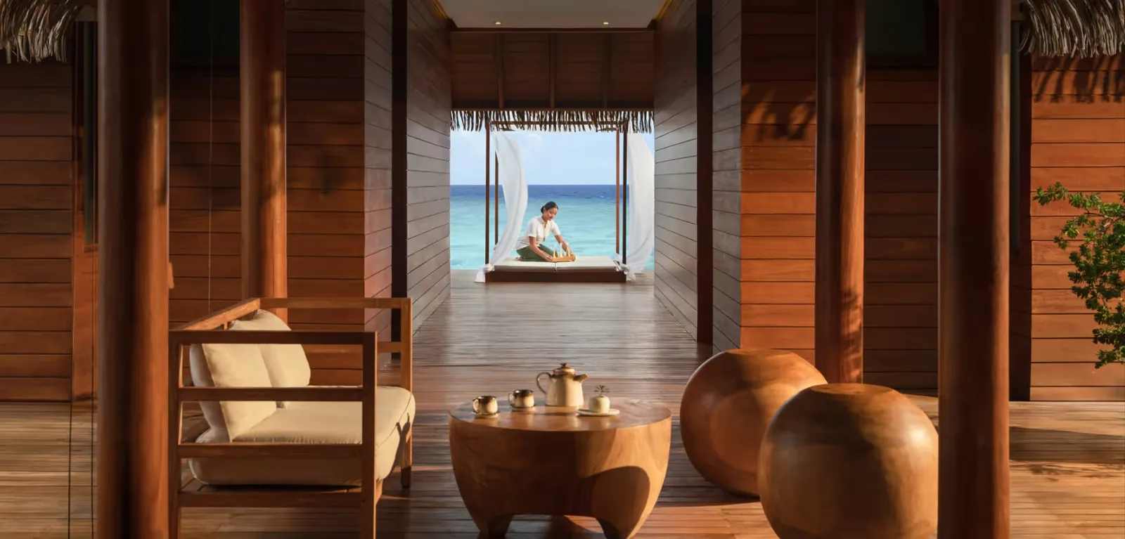 Sea-facing IASO spa area with seating and a tea tray