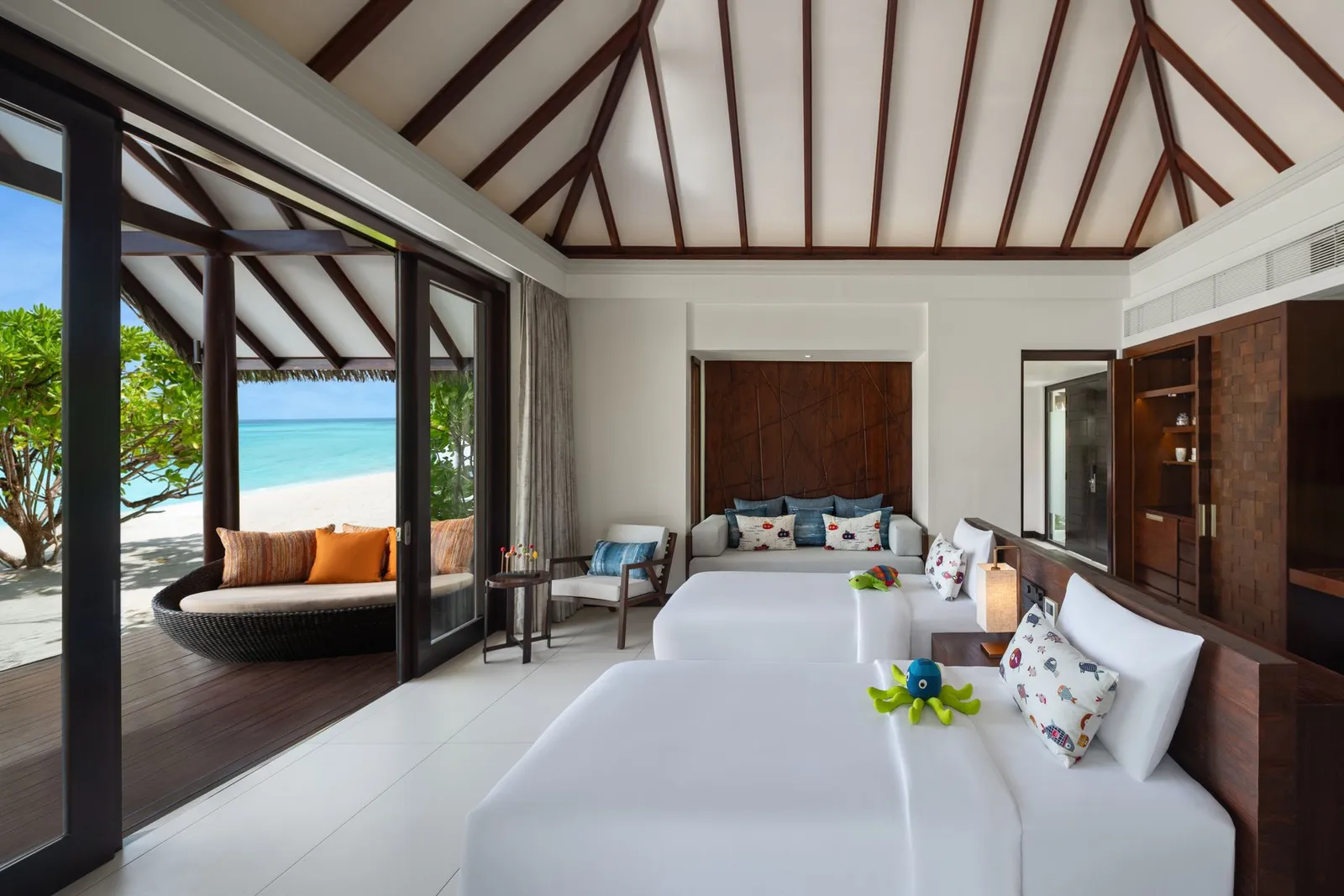 Twin beds and daybed in the Family Pool Beach Villa children’s room