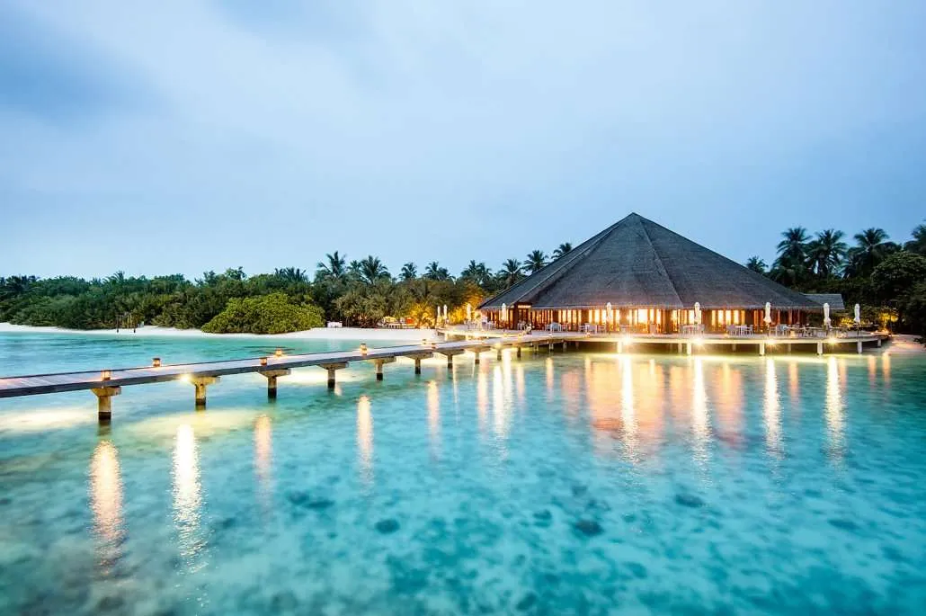 The jetty and illuminated Matheefaru restaurant over the sea.