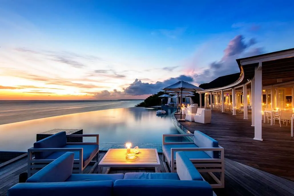 Sunset Pool Café’s pool facing the sea at sunset.