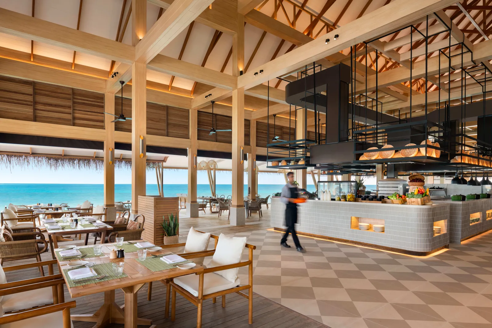 Habitat, the breakfast restaurant, with its high timber ceilings and open kitchen.