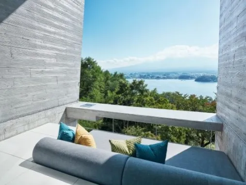 A terrace sofa facing the lake and the mountains