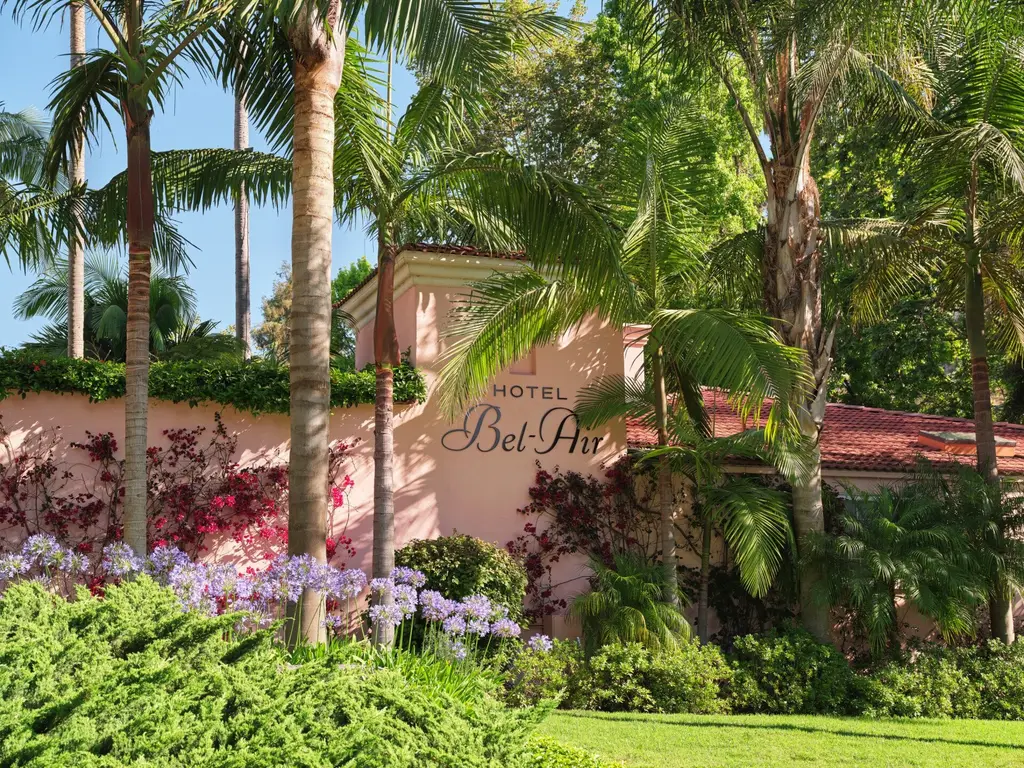 The pink wall with the Hotel Bel-Air lettering, purple agapanthus and palms in front