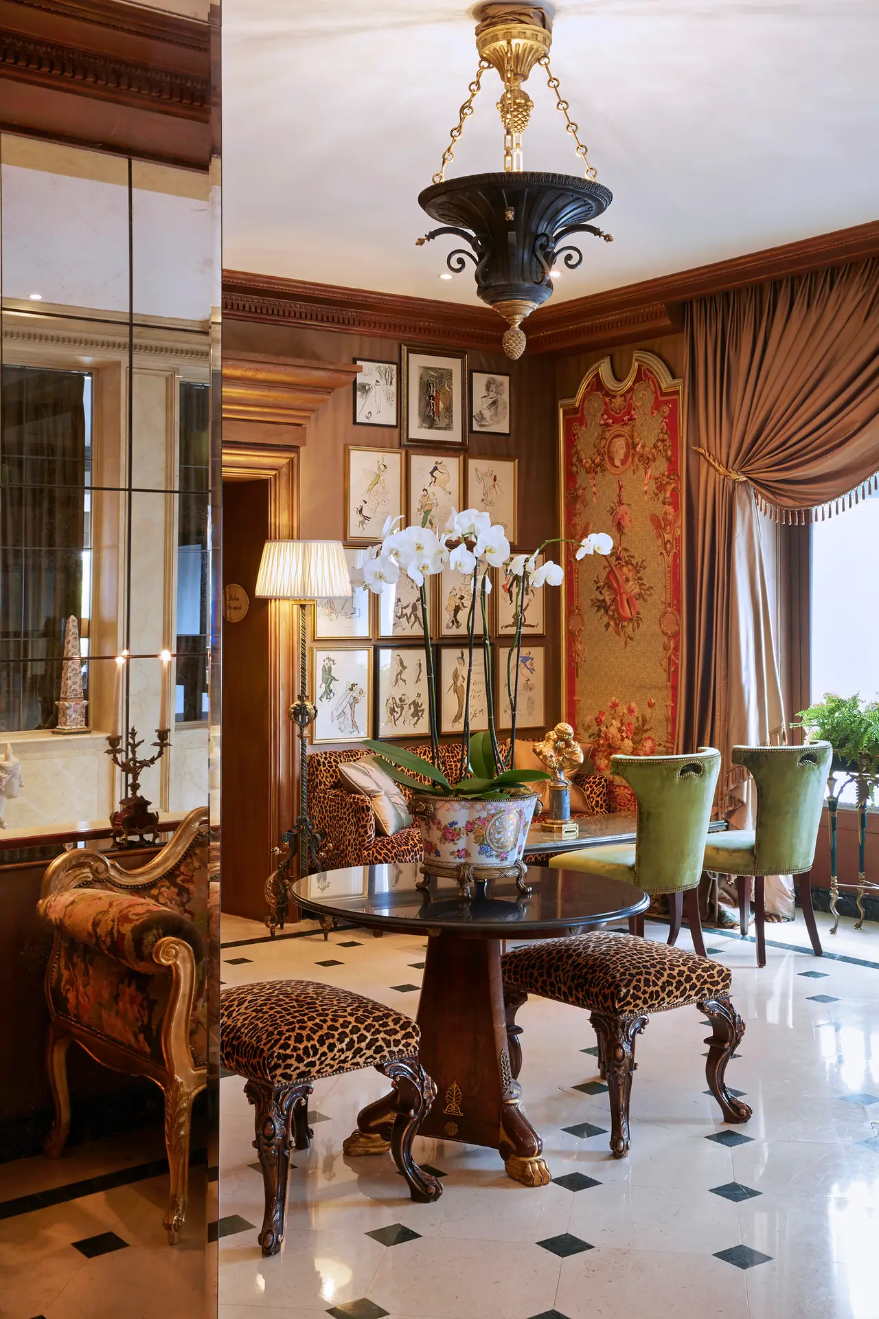 The lobby, with its round table and leopard-print chairs