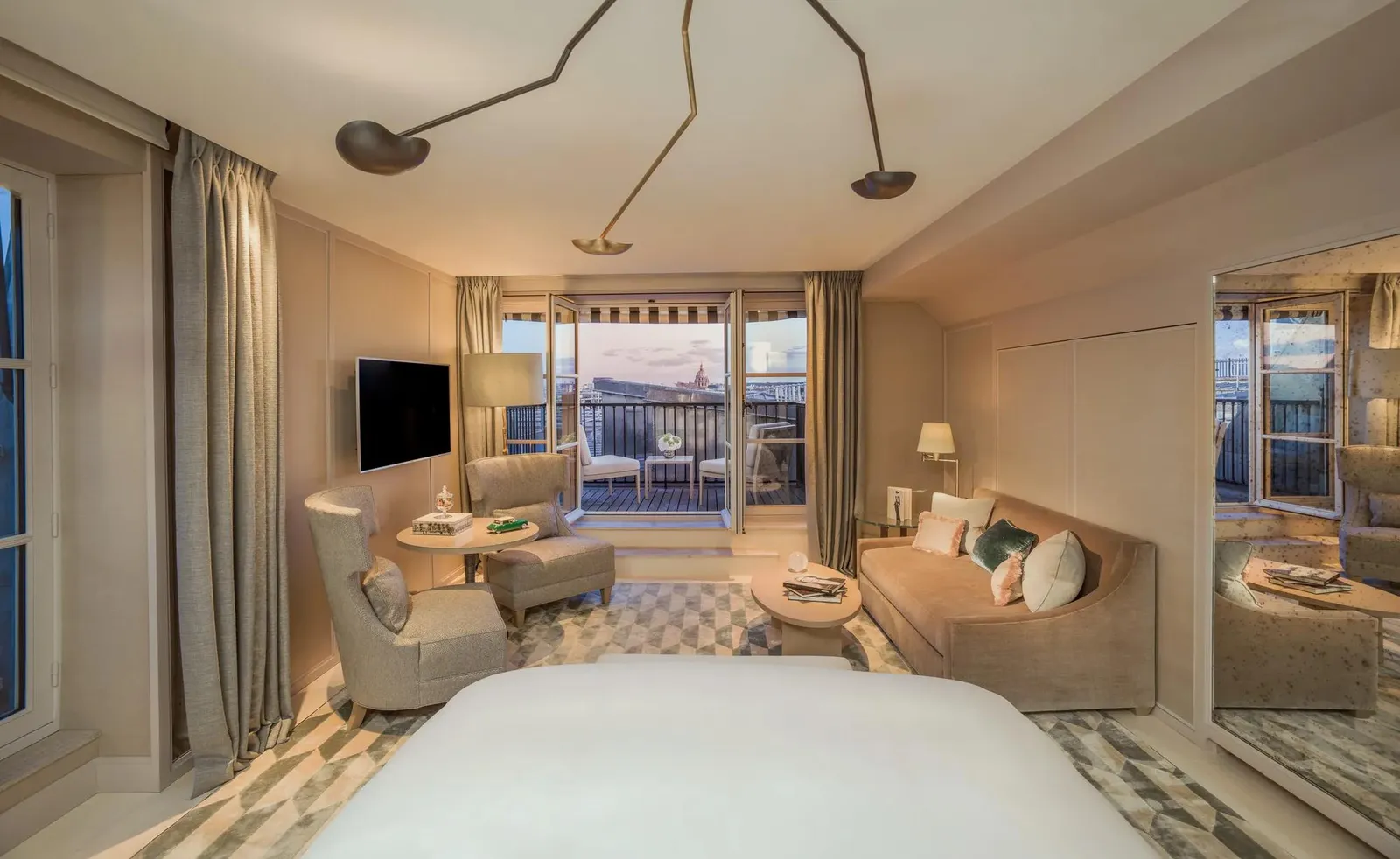 Mansard bedroom with a bed and sitting area