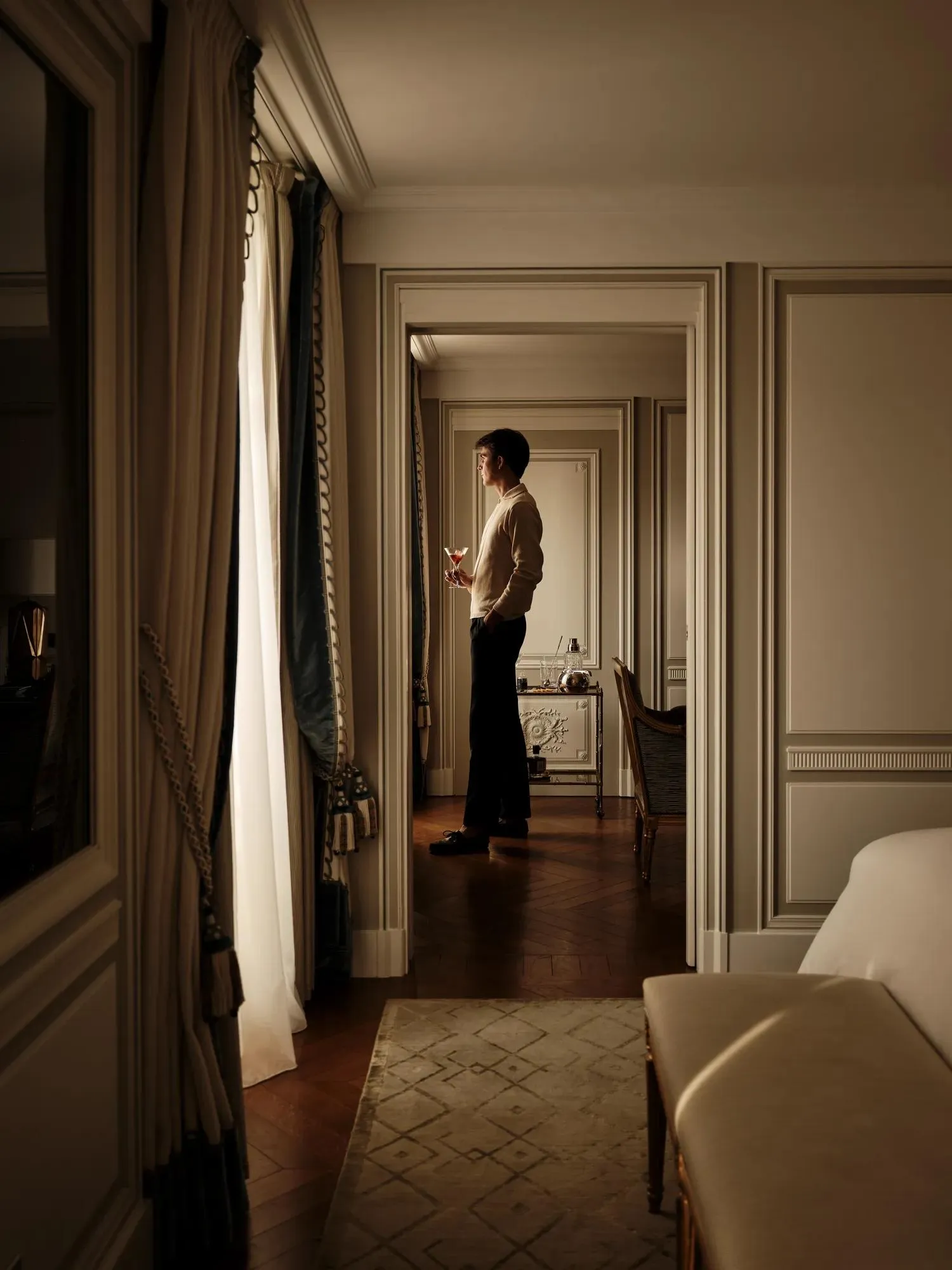 Open doors between the bedroom and sitting room