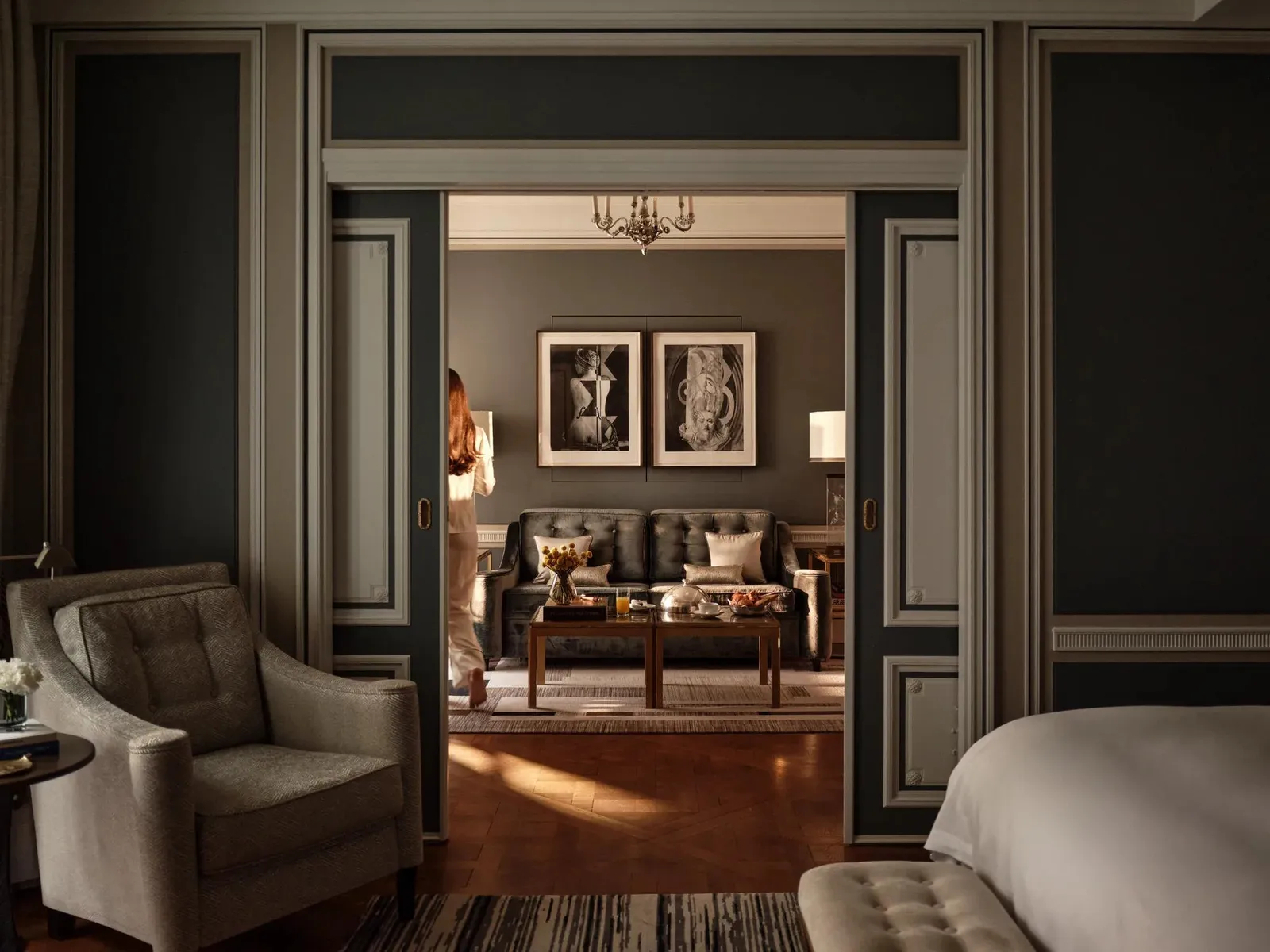 Sitting room seen through dark-framed doors