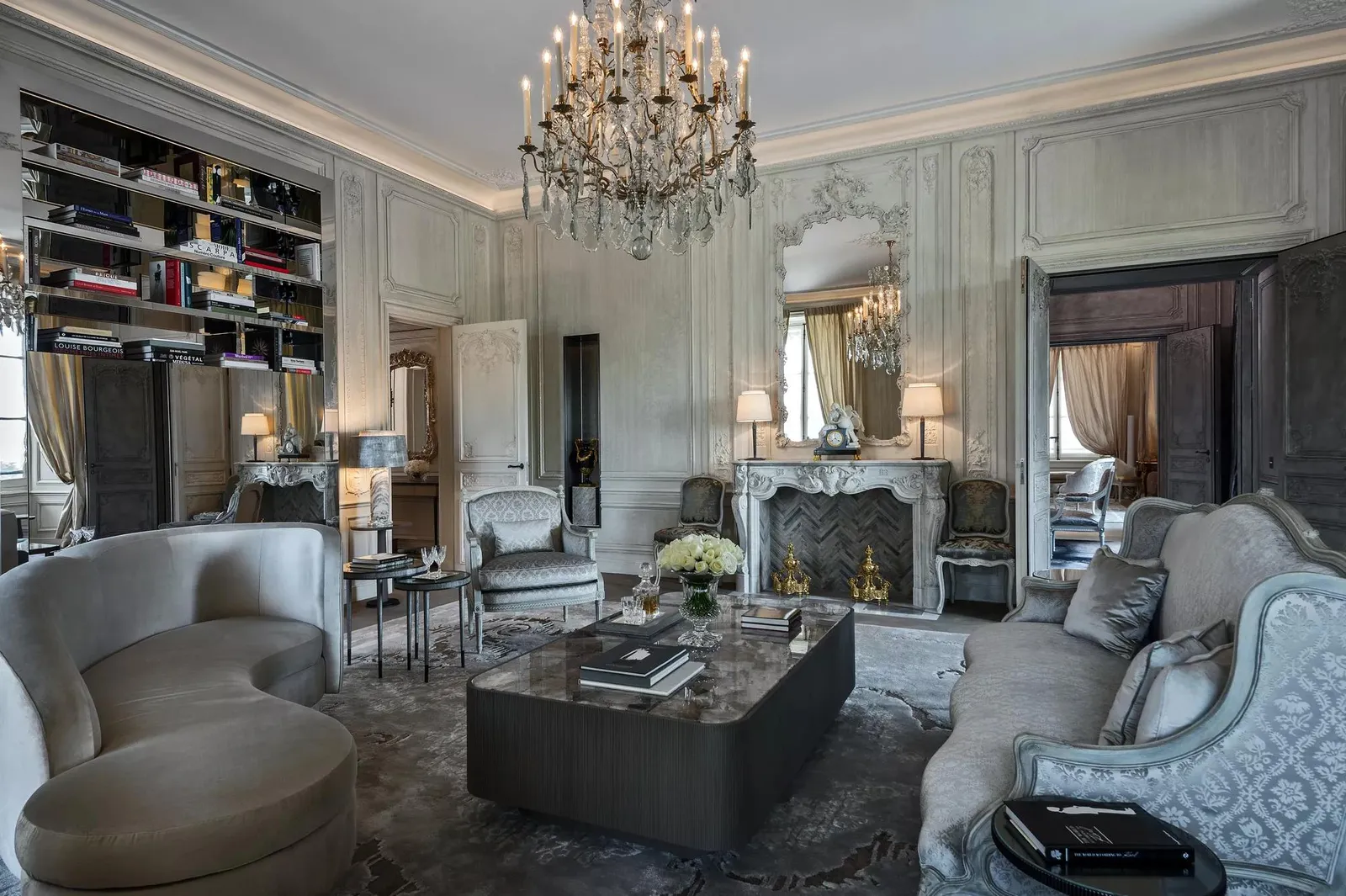Grey sitting room with mirrors, sofas and a coffee table