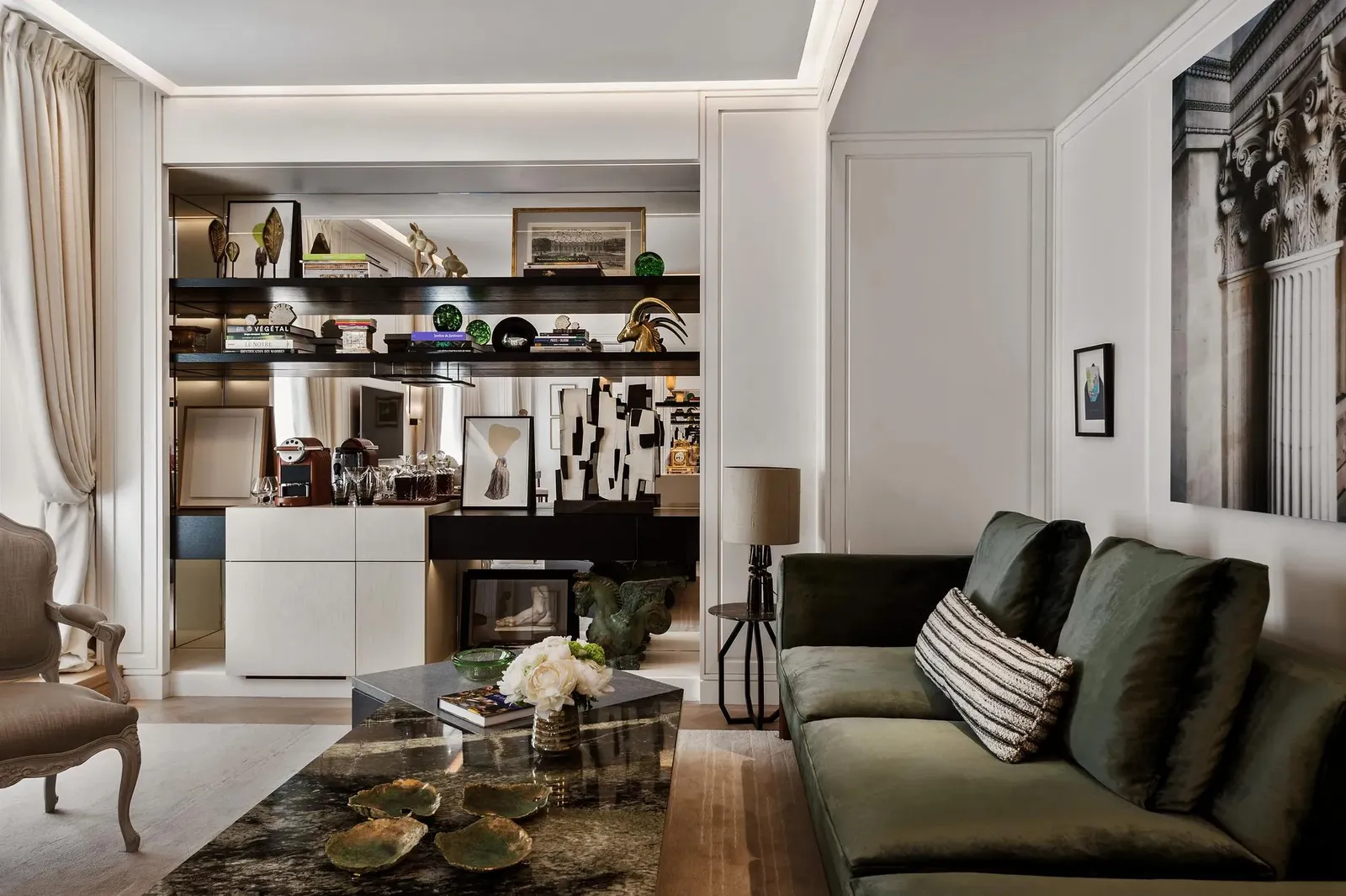 Sitting room with a green sofa and drinks cabinet