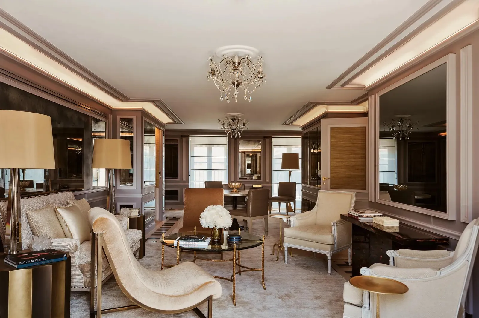 Sitting room with sofas, a chandelier and windows