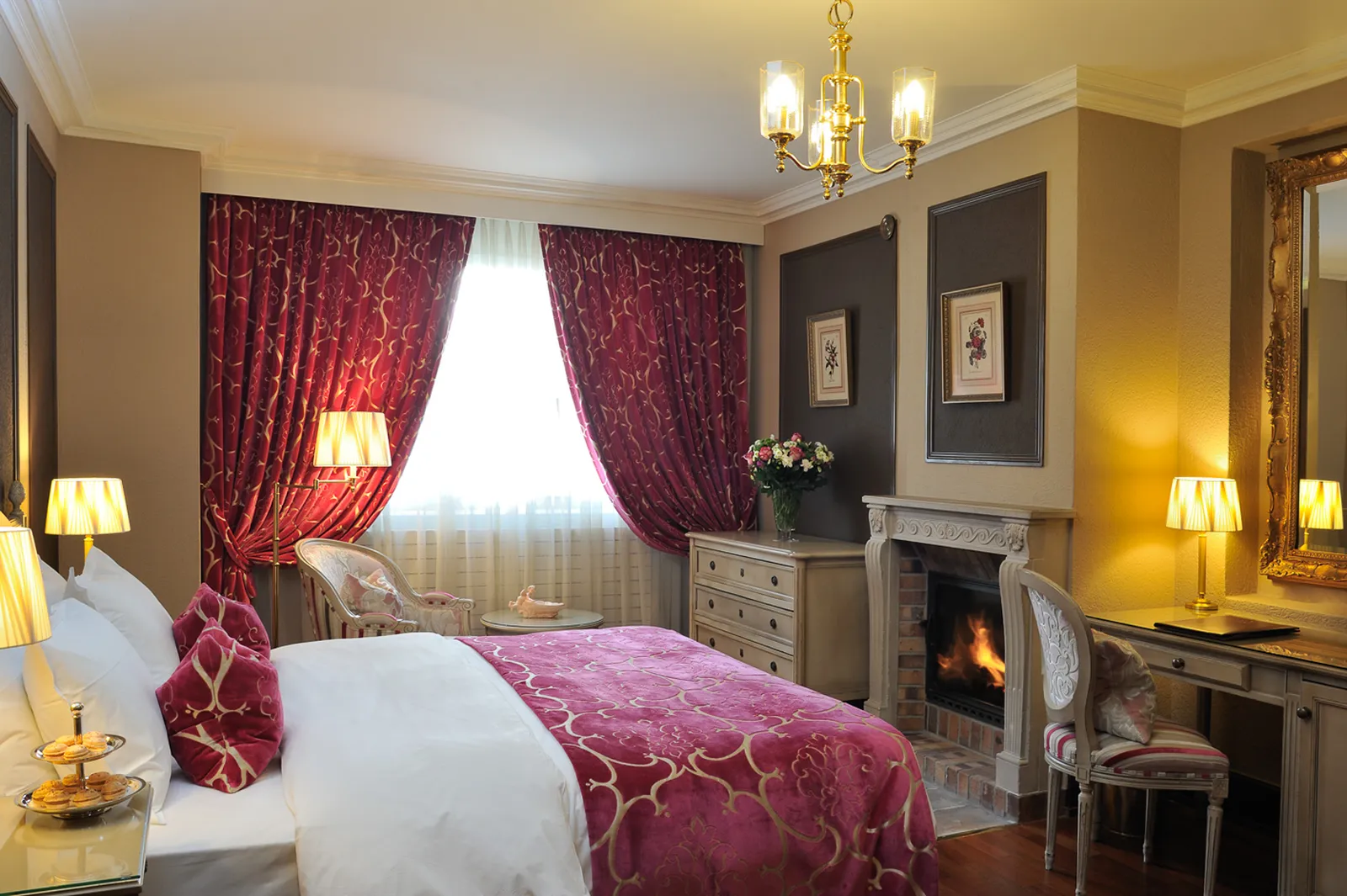 A room with a fireplace and red curtains