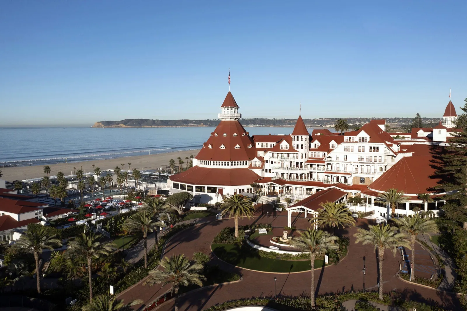 Hotel del Coronado from above, red turrets on the Pacific beach