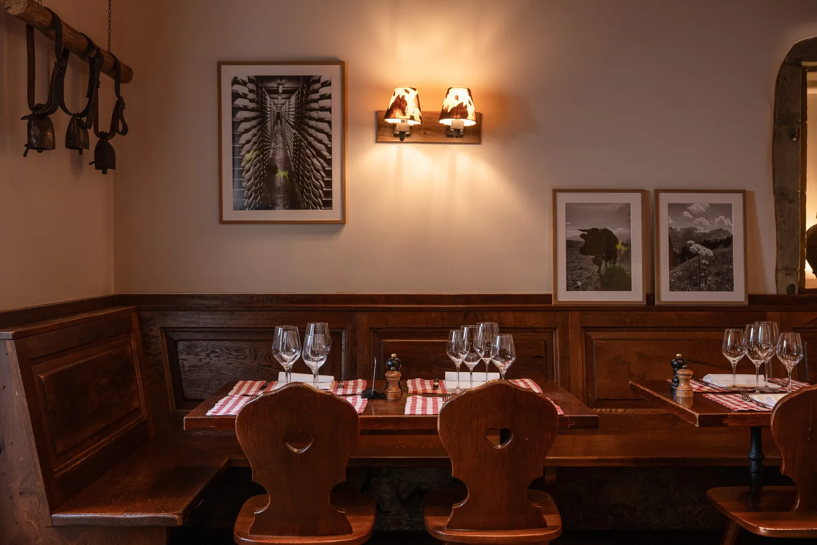 The carnotzet, with wooden benches and checked tablecloths