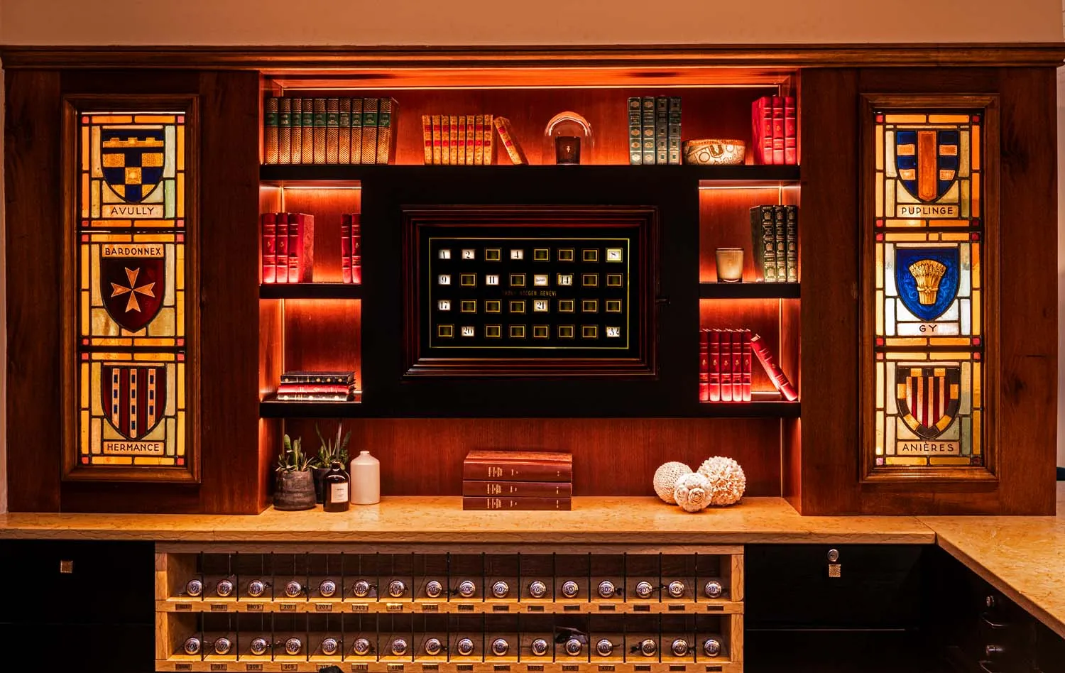 The bookcase with heraldic stained glass