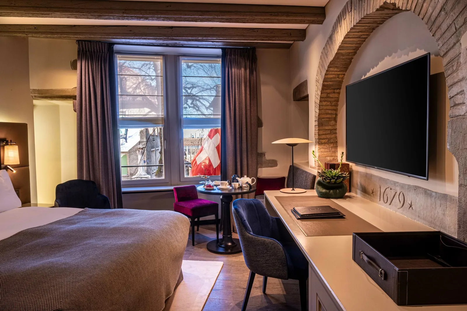 A Deluxe room with beams and stone
