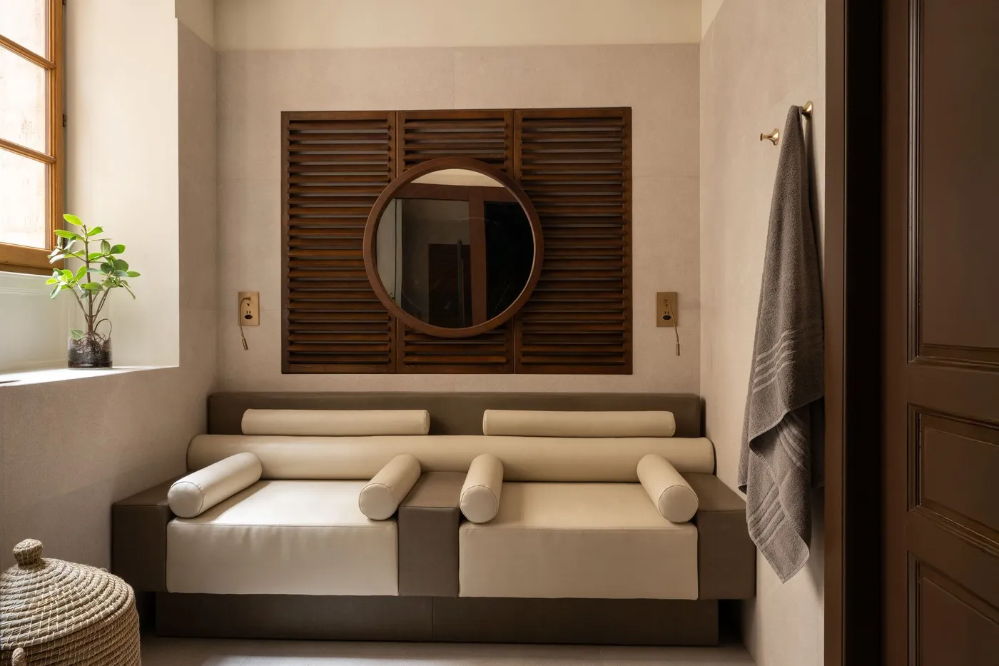 The wellness relaxation area, with loungers under the mirror