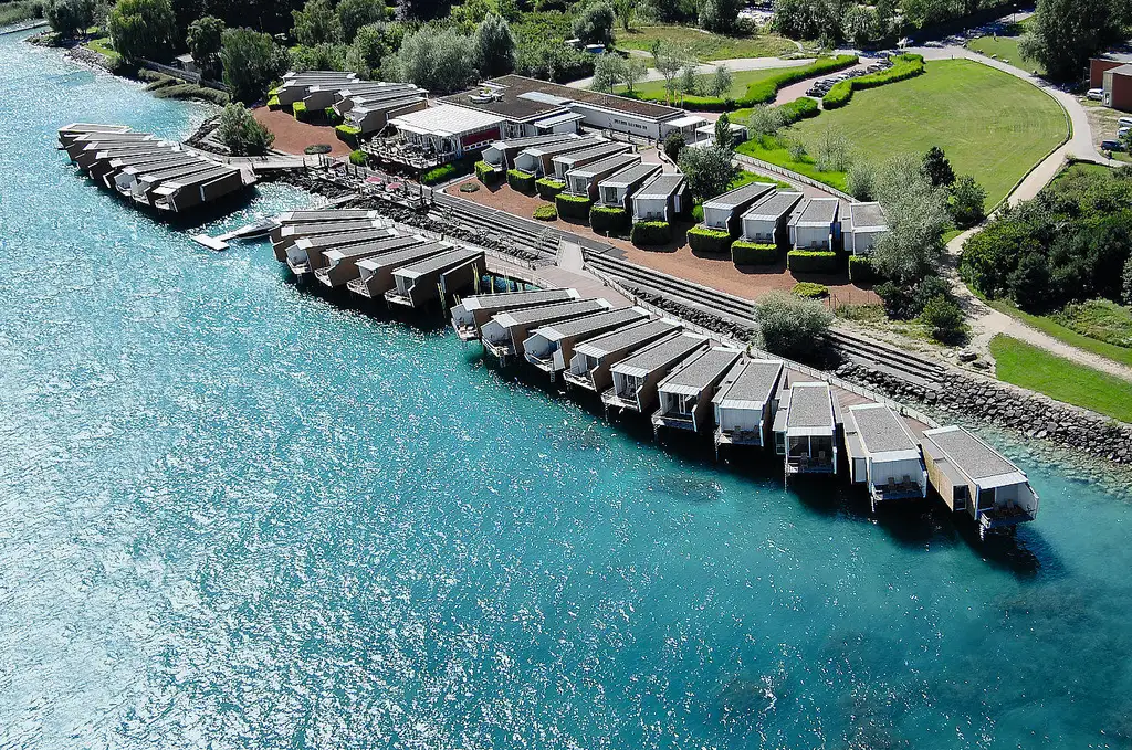 The Palafitte pavilions from above, between the lake and the shore