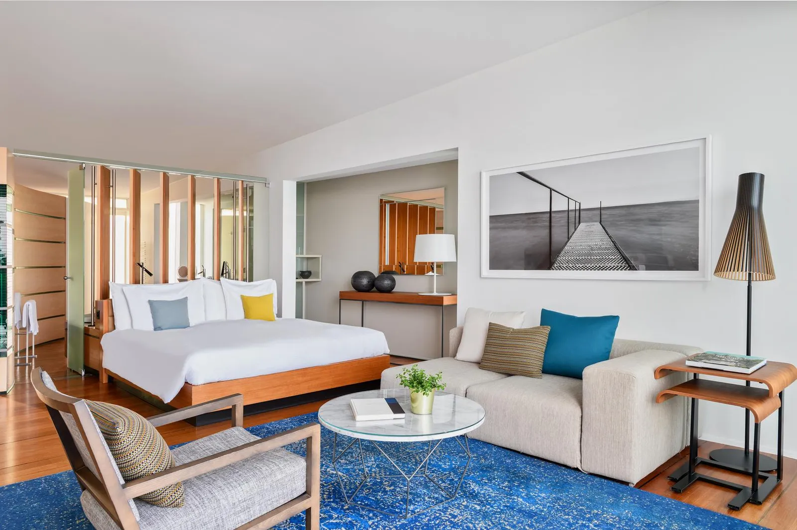 The bed and sitting area of a Lake Pavilion