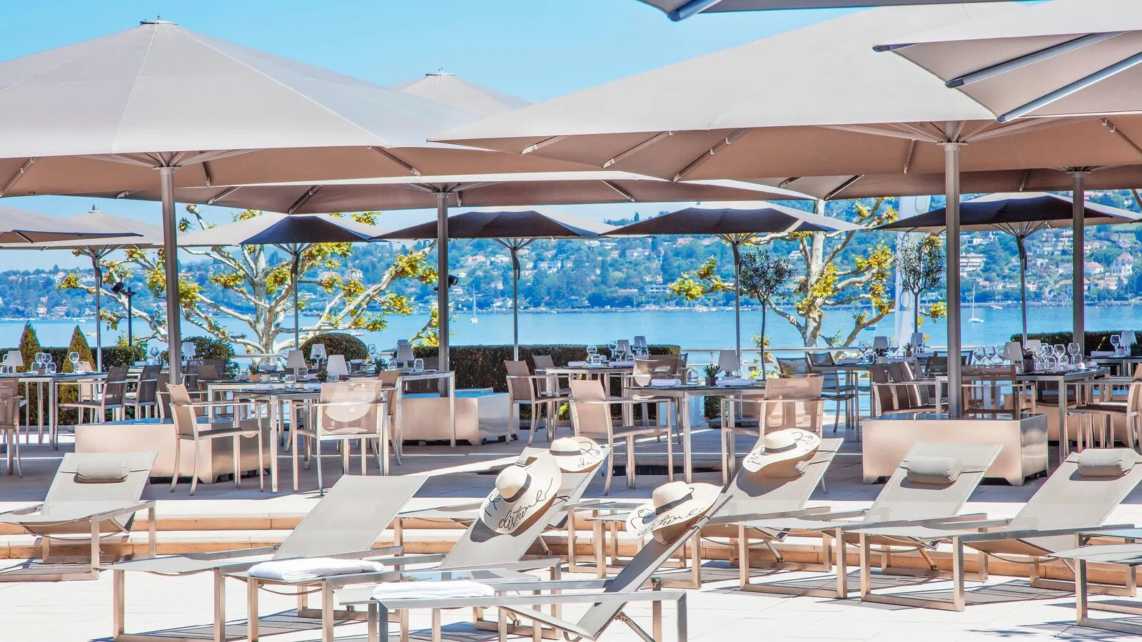 The pool terrace facing Lake Geneva