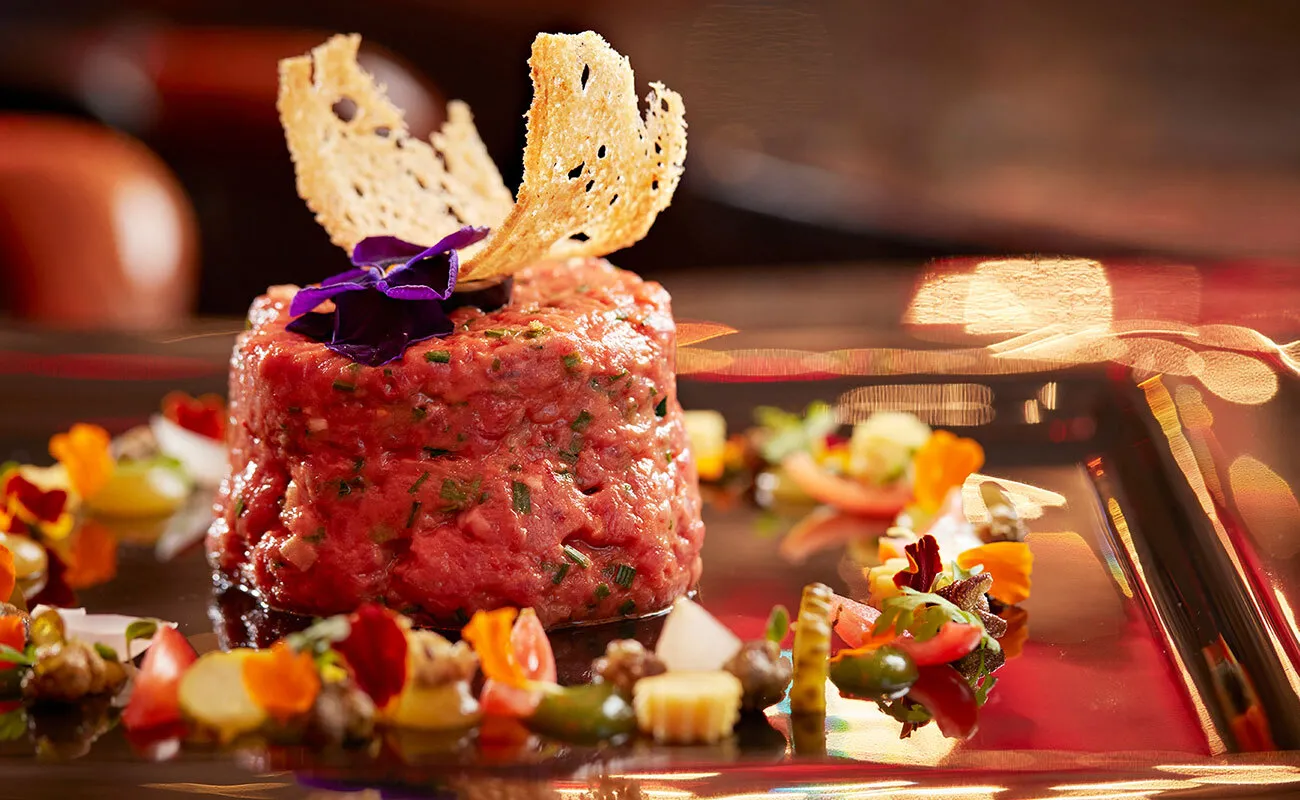 A tartare dish with garnishes