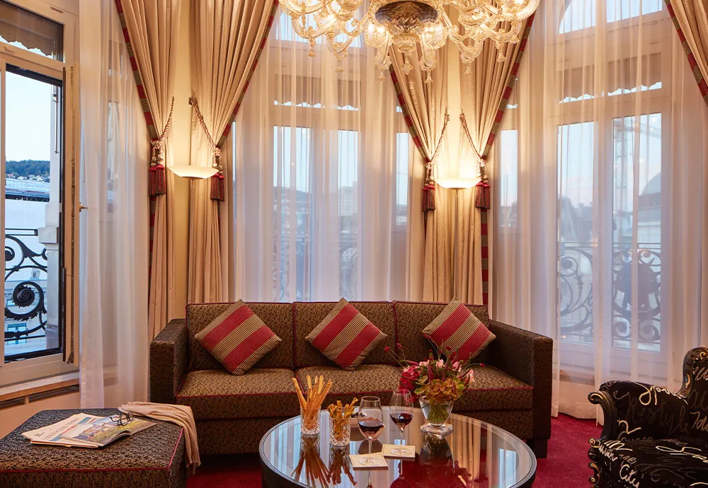 Dufour Signature Suite sitting room, chandelier and balcony