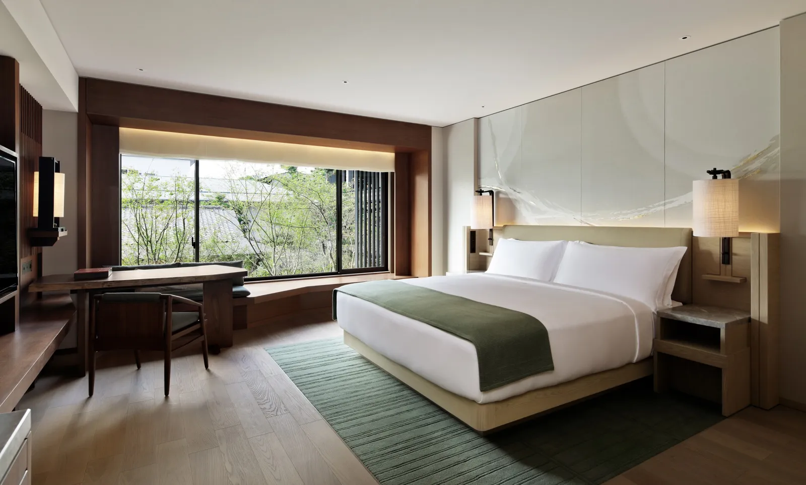 A Garden Room: the king bed facing the wide window onto the garden’s green.